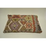 Anatolian kelim cushion, late 19th century, 2ft. 3in. x 1ft. 5in. 0.69m. x 0.43m. Some repairs.