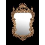 Italian Giltwood Mirror in the Baroque Style, robustly decorated with bold scrollwork and