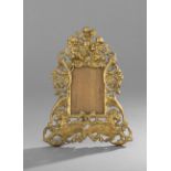 Italian Renaissance-Style Gilt-Bronze Easel Frame, first quarter 20th century, pierced with putti