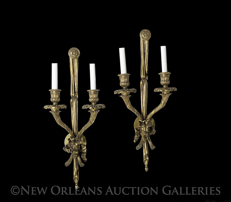 Pair of French Bronze Two-Light Sconces in the Louis XVI Style, each with a backplate in the form of