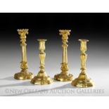 Two Pairs of French Gilt-Bronze Candlesticks, including a Louis XV pair, each with a molded