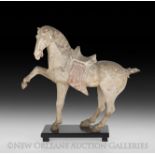 Chinese Painted Pottery Figure of a Prancing Horse, Tang Dynasty (618-906), a lively depiction of