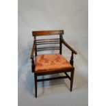 A Regency reeded mahogany elbow chair wi