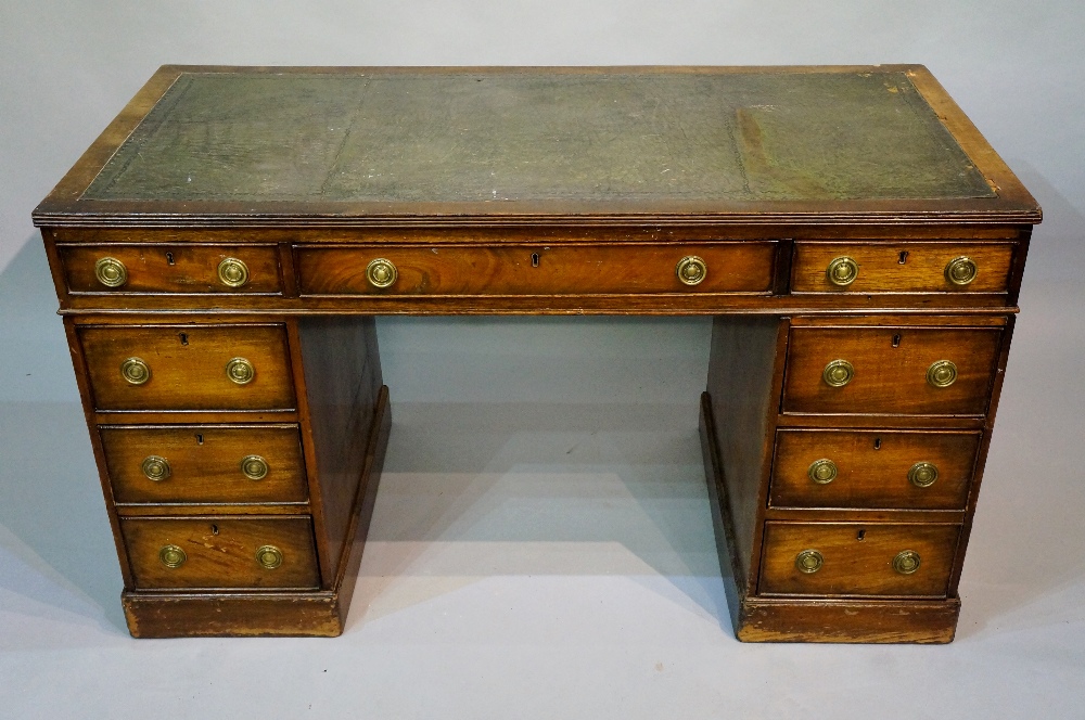 A George III style mahogany pedestal des