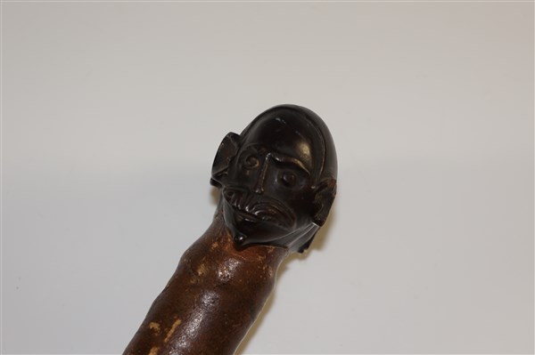 An ebonised bamboo sword stick with Afri