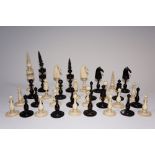 A 19th Century bone chess set, King 10 c