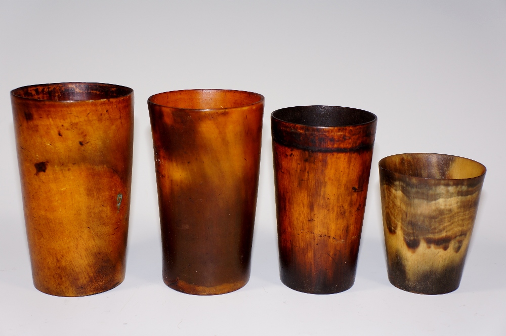 Four horn beakers, all tapered cylindric