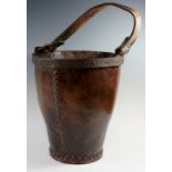 A Victorian leather bucket of tapered cy
