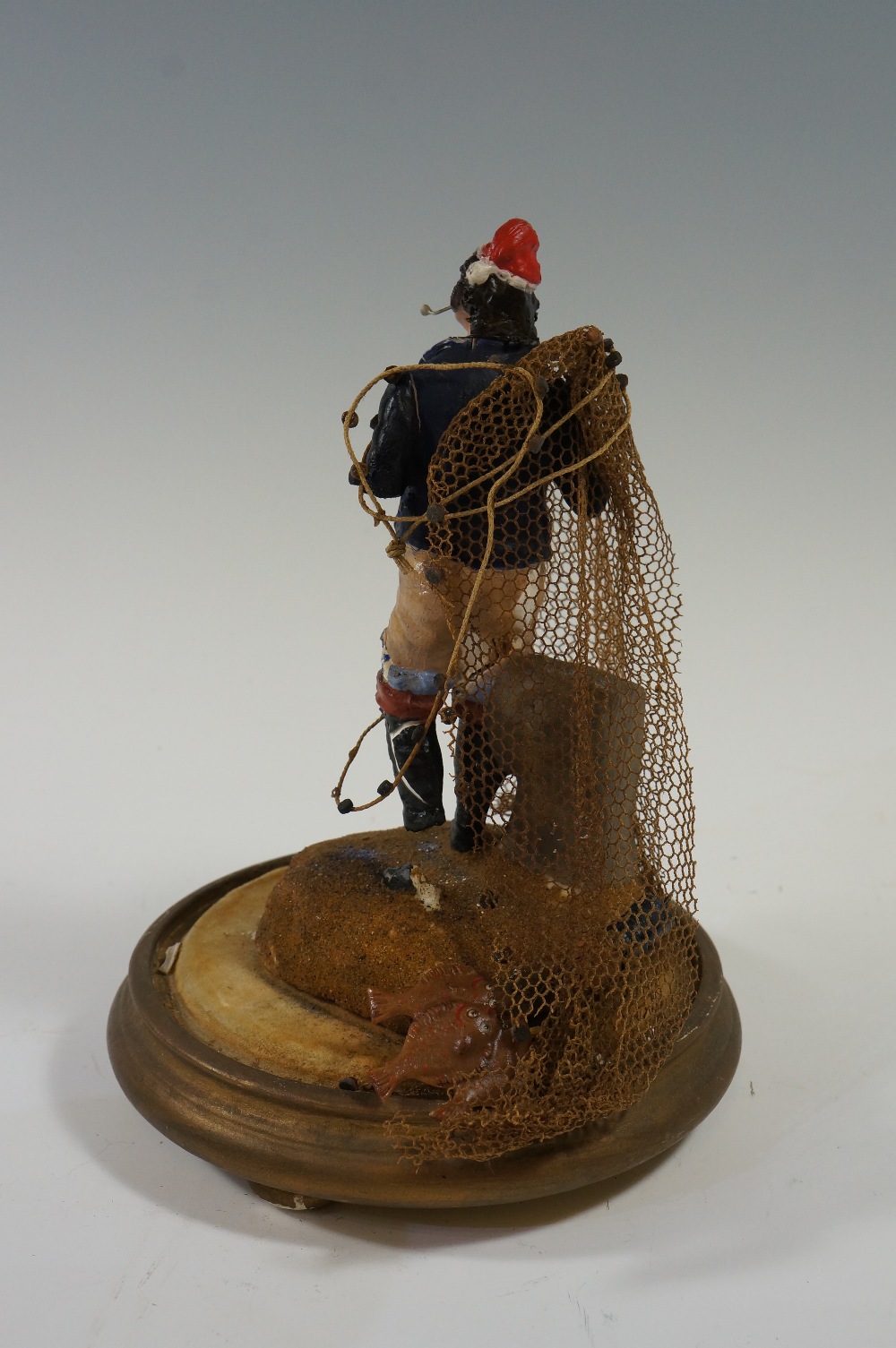 A wax figure of a fishermen with fish an - Image 3 of 3