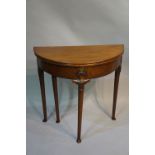 A George II mahogany D-shaped tea table