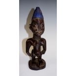 An African carved wood figure, 26 cm hig