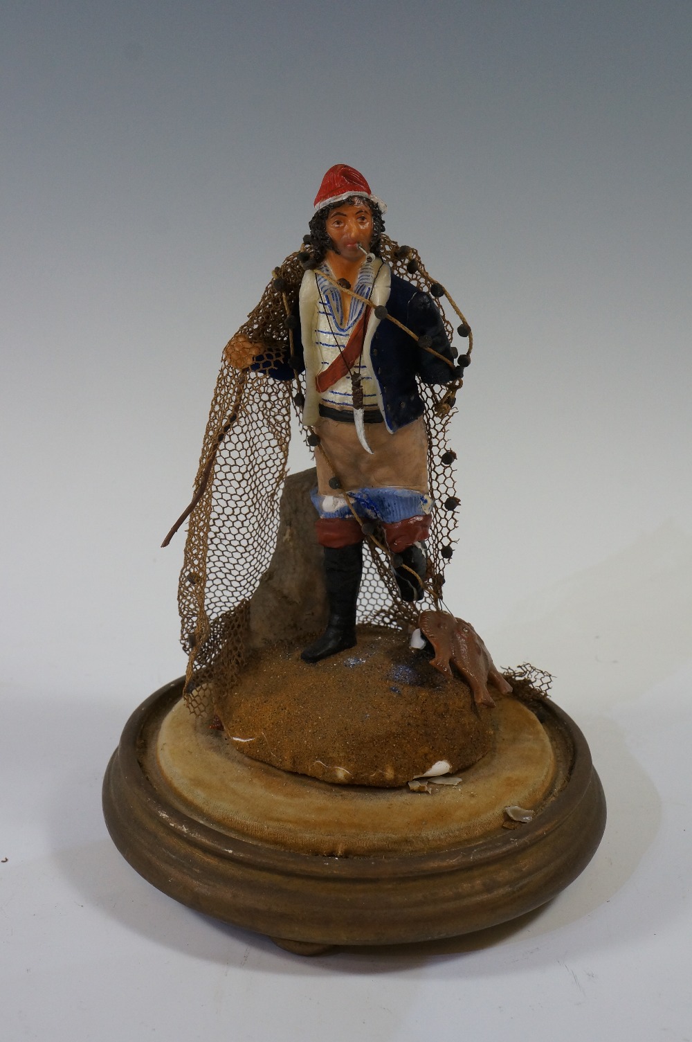 A wax figure of a fishermen with fish an - Image 2 of 3