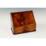 A Victorian burr walnut letter box of co