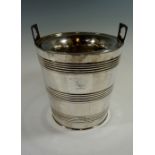 A silver plated sleeved tapering cylindr