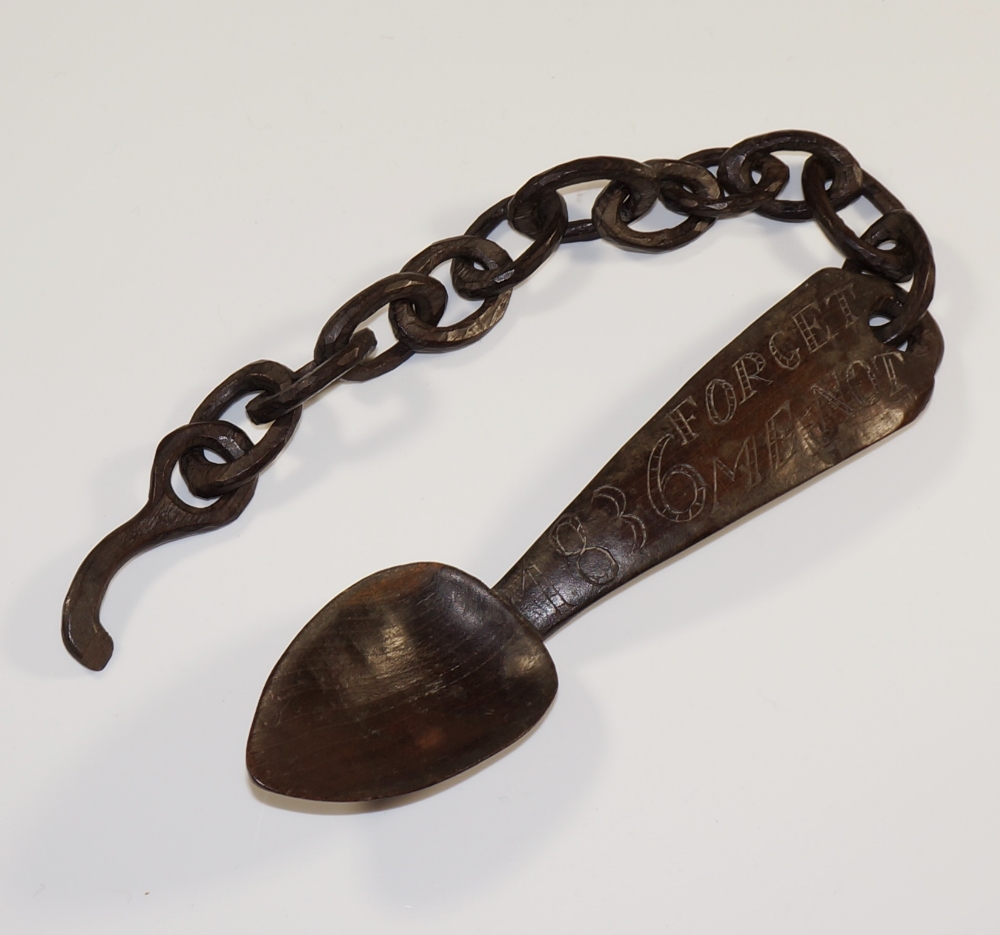 A Welsh love spoon and chain with tapere