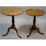A mahogany tripod table on ring turned v