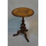 A Victorian walnut occasional table the