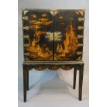 A Chinese black lacquer cabinet on stand