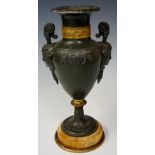 A bronzed spelter classical urn the body cast with palmettes and fluting scrolls,