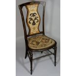 An American "Mic Mac" chair the stained gilt highlighted frame with stylised leaf and dot