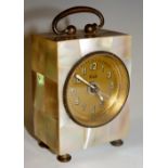 A continental mother of pearl veneered miniature carriage clock with plain handle the brass dial