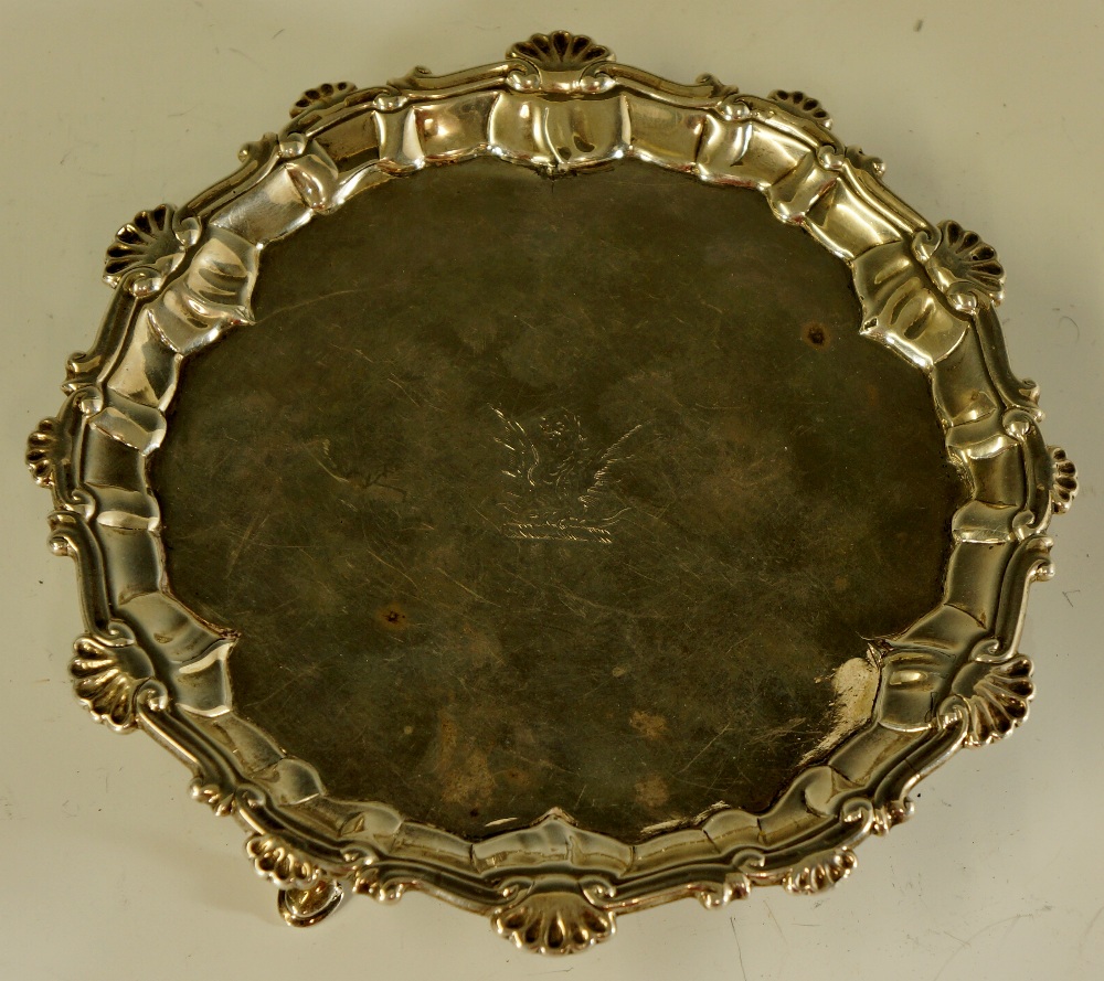 An early George III shaped circular waiter the border shell and scroll cast,