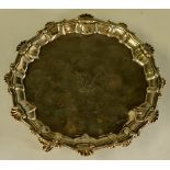 An early George III shaped circular waiter the border shell and scroll cast,