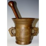 A 19th Century bronze pestle and mortar of conventional design the body engraved with initials and