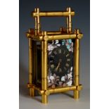 A good French miniature brass cased carriage timepiece with post and bale frame and conforming