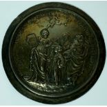 A circular silver shoulder badge - Christ's Hospital School, embossed with figures and cherubs,