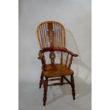 A 19th Century yew-wood high back broad arm Windsor chair,