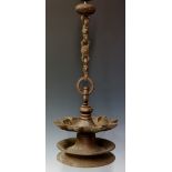 A 19th Century Islamic bronze oil lamp with bold suspension chain the shallow dish with nine spouts,