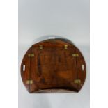 A mahogany butler's tray with brass fittings and kidney-shaped carrying handles, 85cm wide max.