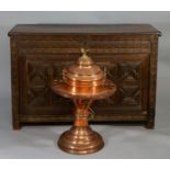 A Continental spun copper pedestal brazier with liner and cover, with bird finial,