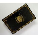 A Victorian black enamelled folding box, emblazoned 'The Traveller's Sandwich Box',