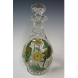 A Richardson cut glass decanter decorated with vitrified enamelled water lilies, leaves and stems,