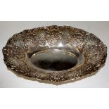 A Victorian shaped oval dish embossed with alternate panels of flower heads and shells,