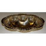 A shaped oval dish with scroll cast border,