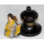 A painted black iron inkwell with hinged lid,