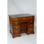A George III mahogany kneehole desk,