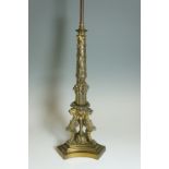 A mid 19th Century bronze lamp the tapered column foliate and fruit cast with foliate collar above