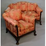 An Edwardian mahogany sofa in George III style the frame carved with Vitruvian scroll on hairy paw