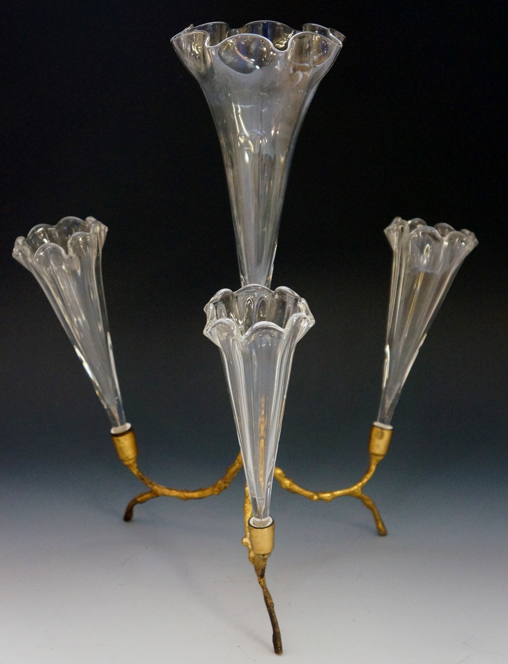 A four-flute epergne, the crystal flutes on naturalistic ormolu stand, frilled rims, 35cm high,