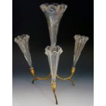 A four-flute epergne, the crystal flutes on naturalistic ormolu stand, frilled rims, 35cm high,