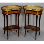 A pair of Louis XVI style kidney-shaped marble topped two tier tables with brass foliate mounts,