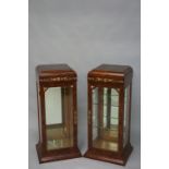A pair of Continental gilt metal mounted amboyna veneered display cabinets of Art Deco style,
