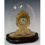 An American ? gold painted iron cased mantel clock the ivorine dial with Roman numerals inscribed ..