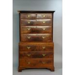 A George III mahogany chest on chest the flared cornice above two short and three long graduated
