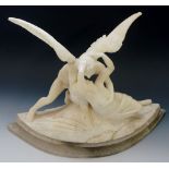 A white marble figure group of an angel holding lightly draped female figure, alabaster base,