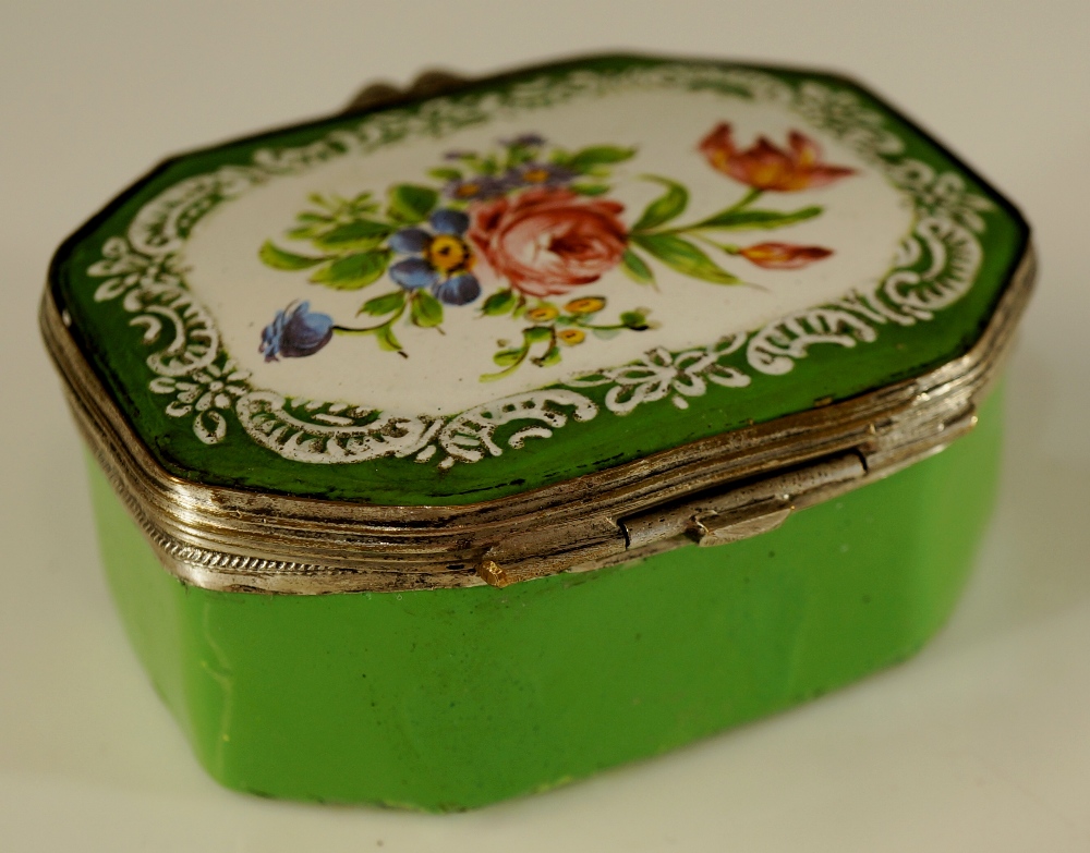 A 19th Century enamel pill box the hinged cover painted with a floral spray within a white enamel - Image 2 of 2